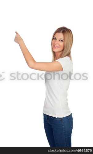 Attractive blonde pointing something with her finger isolated on a white background