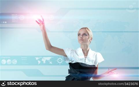 Attractive blonde touching the world map virtual future interface. Light flashes. One of a 200+ series.