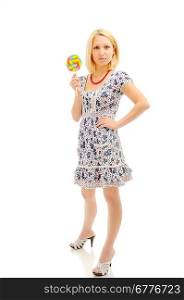 Attractive blonde with lollipop over white background