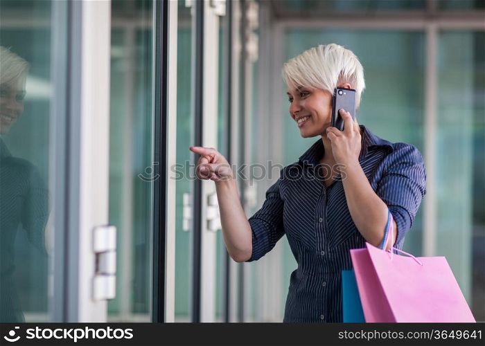Attractive blonde woman with shopping bags
