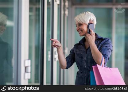 Attractive blonde woman with shopping bags