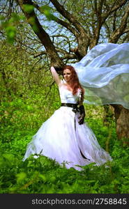 attractive bride girl in elegant dress. outdoor shot