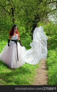 attractive bride girl in elegant dress. outdoor shot