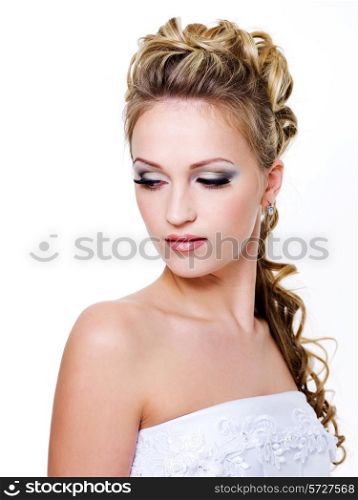 Attractive bride with style wedding hairstyle - isolated