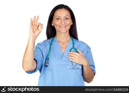 Attractive brunette doctor saying Ok isolated on a over white background