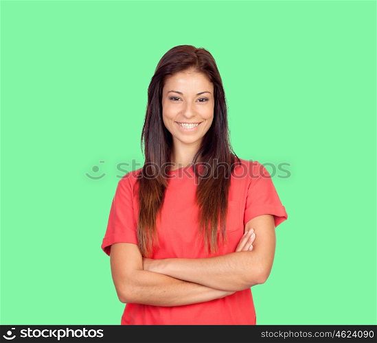 Attractive brunette girl dressed in red on a green background