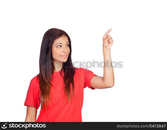 Attractive brunette girl dressed in red pressing something isolated on a white background