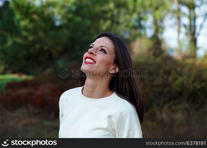 Attractive brunette girl enjoying a day in the countryside