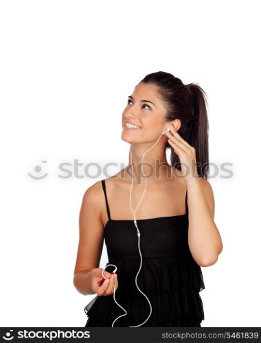 Attractive brunette girl looking up and listening to music isolated on a white background