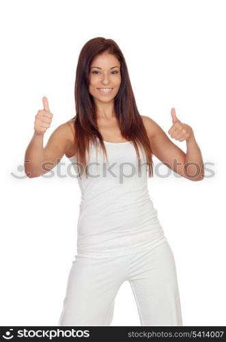 Attractive brunette girl saying Ok dressed in white isolated