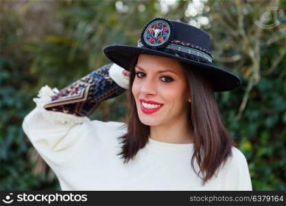 Attractive brunette girl with elegant black hat