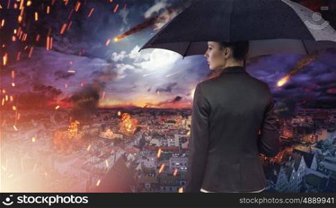 Attractive brunette lady staring at the natural disaster