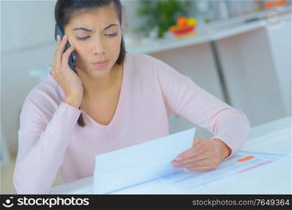 attractive brunette on phone with worried facial expression