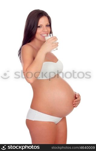 Attractive brunette pregnant in underwear drinking milk and milk isolated on a white background