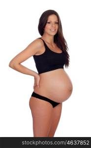 Attractive brunette pregnant in underwear with her hands in the kidneys isolated on a white background