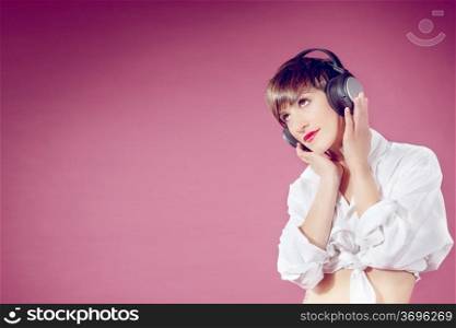Attractive brunette woman with headphones listening to music