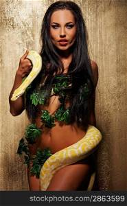 Attractive brunette woman with python