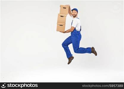 Attractive builder jumping with the boxes