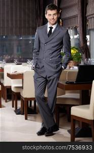 Attractive business man in suit stay in restaurant