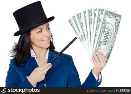 attractive business woman with a magic wand and hat making appear giant dollars (a over white background)