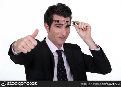 attractive businessman thumb up with glasses raised