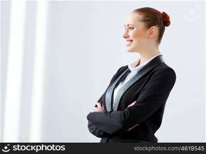 Attractive businesswoman in black suit. Image of young businesswoman in black suit