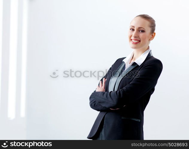 Attractive businesswoman in black suit. Image of young businesswoman in black suit