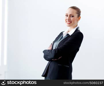 Attractive businesswoman in black suit. Image of young businesswoman in black suit