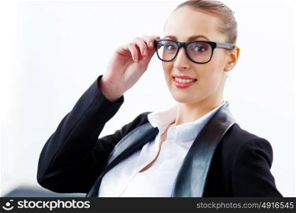 Attractive businesswoman in black suit. Image of young businesswoman in glasses wearing black suit