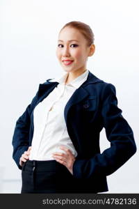 Attractive businesswoman in formal suit. Image of young asian businesswoman in formal suit