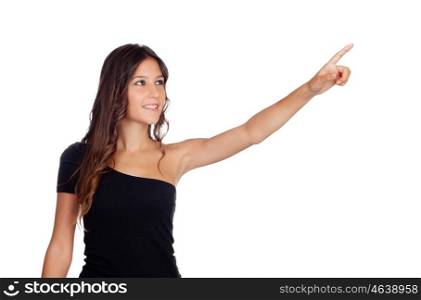 Attractive casual girl in black indicating something isolated on white