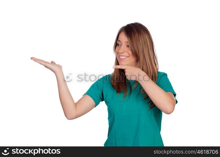 Attractive casual girl pointing something with the hand isolated on white background