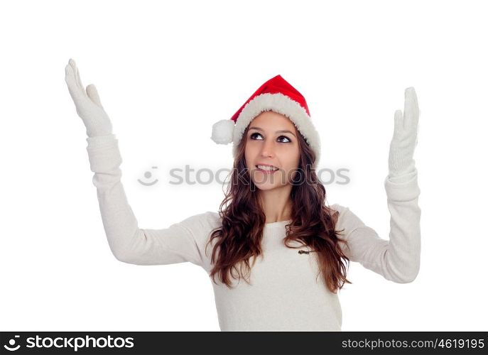 Attractive casual girl with Christmas hat extending her arms isolated on a white background