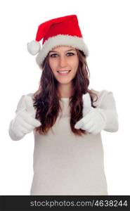 Attractive casual girl with Christmas hat saying Ok isolated on a white background