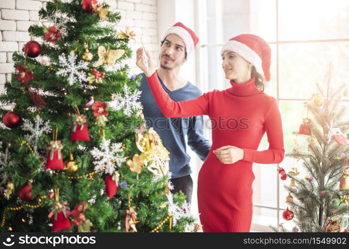 Attractive Caucasian couple of love are celebrating Christmas in home