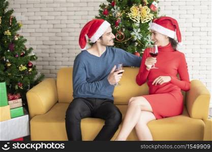 Attractive Caucasian couple of love are celebrating Christmas in home