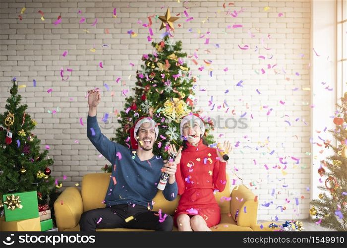 Attractive Caucasian couple of love are celebrating Christmas in home