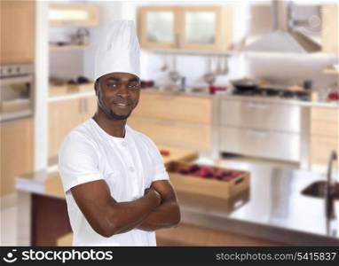 Attractive chef in the cuisine of his restaurant