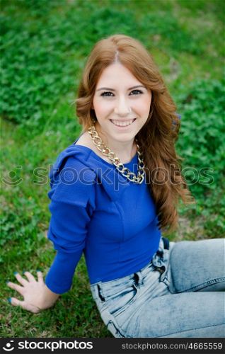 Attractive cool woman dressed in blue and a piercing in her nose
