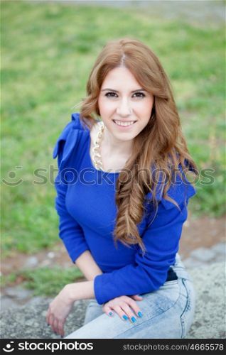 Attractive cool woman dressed in blue and a piercing in her nose