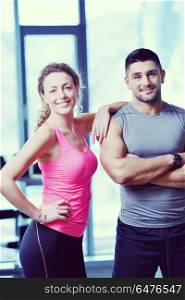 attractive couple at the gym looking happy. couple at the gym