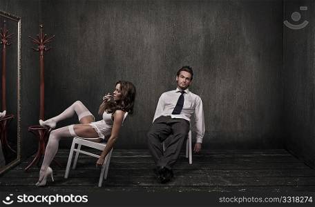Attractive couple in a dark room