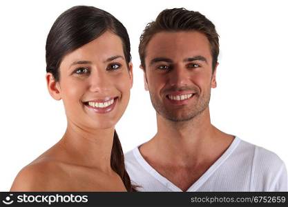 Attractive couple stood in studio