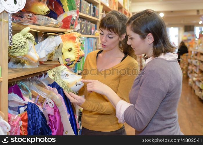 attractive customer and seller at the toy store