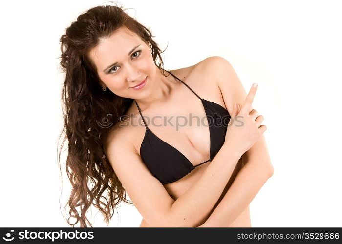 attractive dark-haired woman in a black bikini. isolated on white