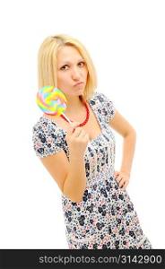 Attractive dissatisfied blonde with lollipop over white background