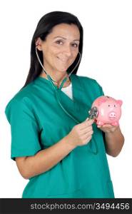 Attractive doctor performing a medical examination pink piggy-bank isolated over white