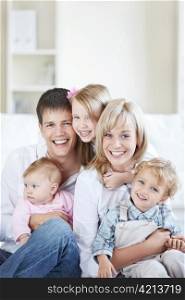 Attractive family with three children at home