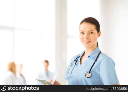 attractive female doctor or nurse in hospital