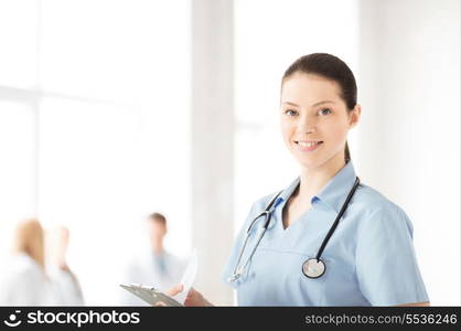 attractive female doctor or nurse in hospital